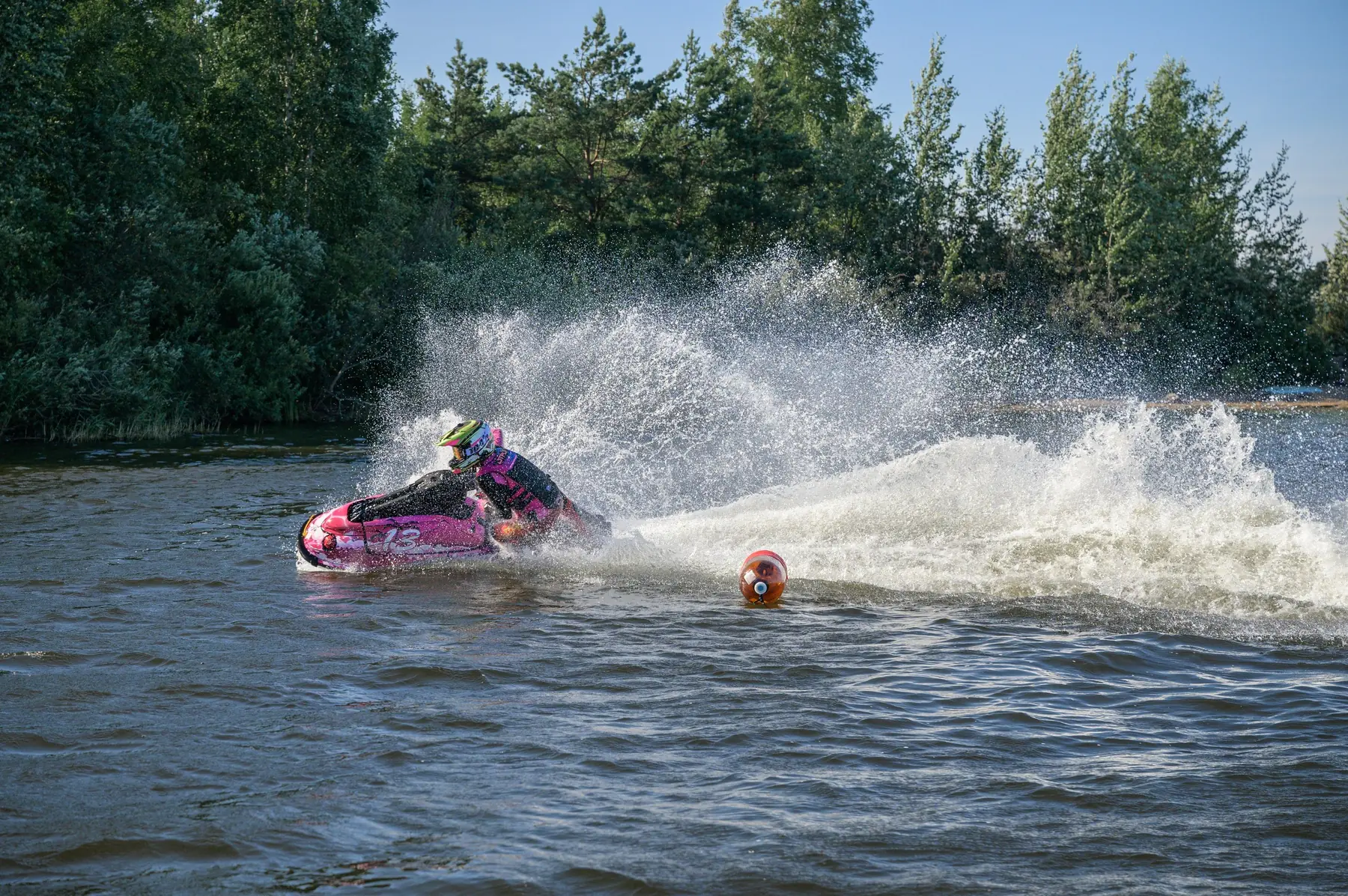 Eva confidently rounds a buoy on her aquabike