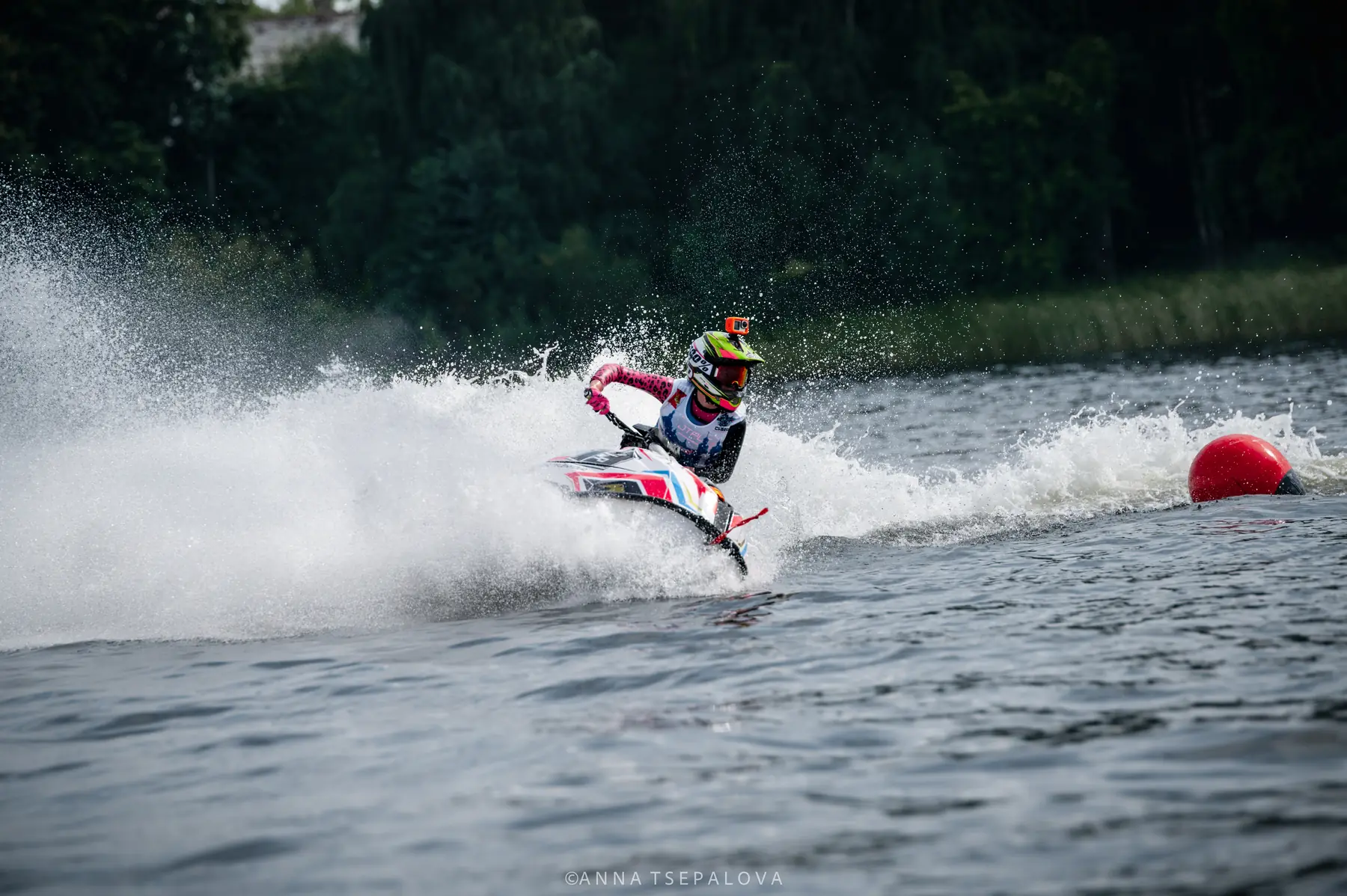 Eva and her aquabike airborne above the water