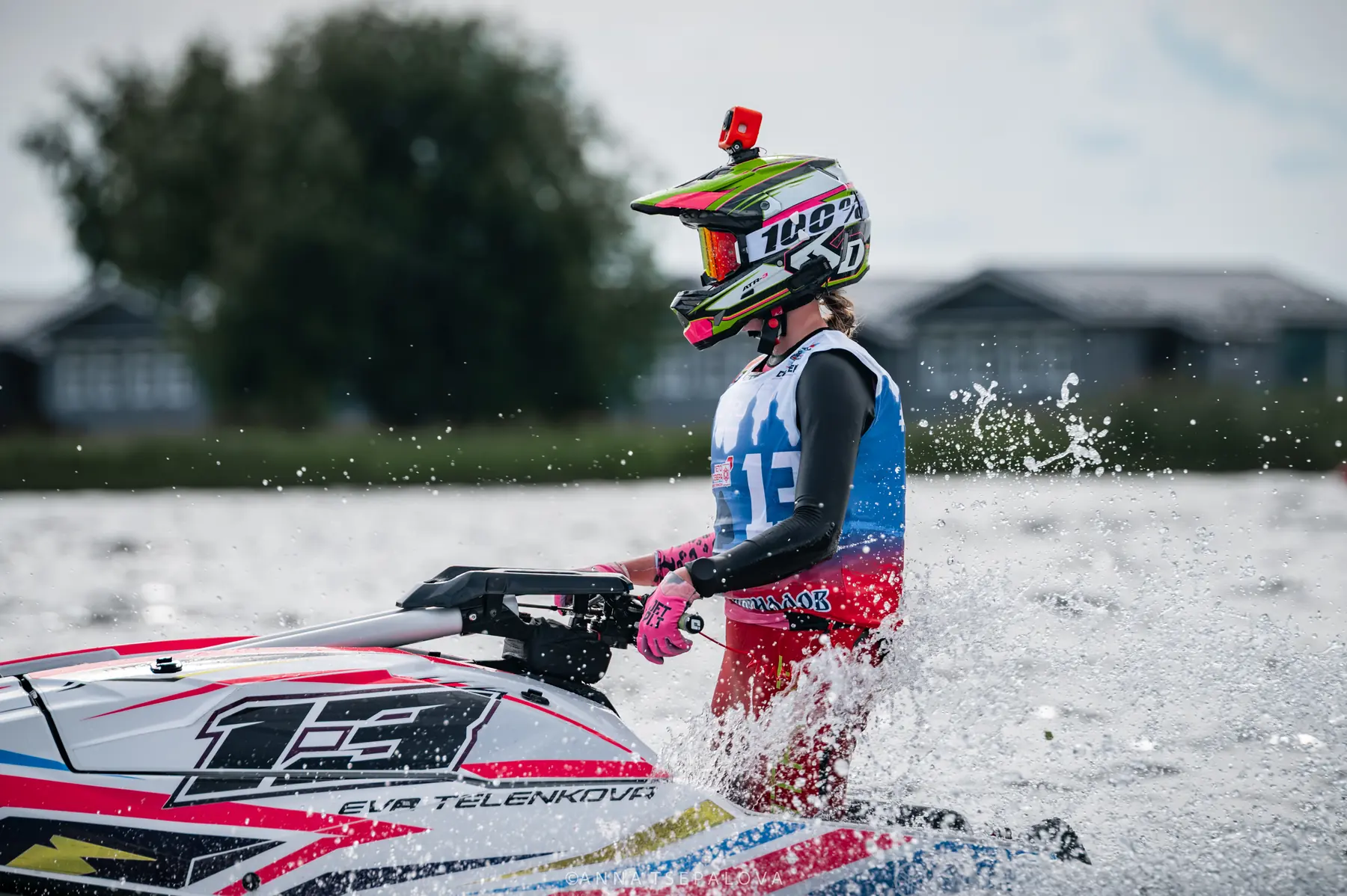 Eva focused beside her aquabike before a race